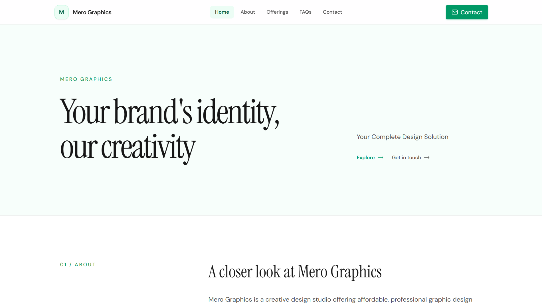 Mero Graphics website displayed on a laptop screen